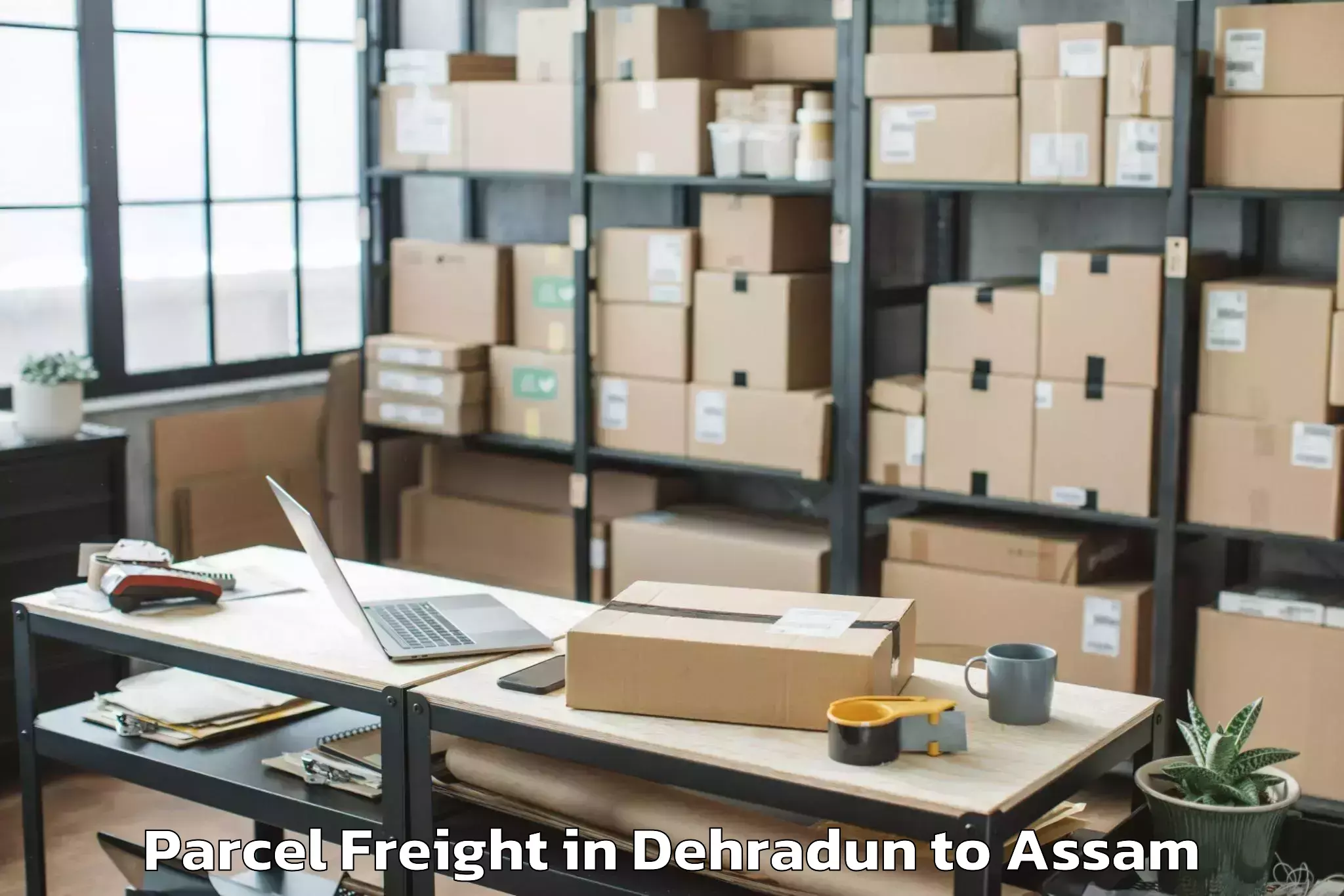 Leading Dehradun to Narayanpur Lakhimpur Parcel Freight Provider